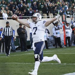 Brigham Young Cougars quarterback Taysom Hill (7) scores against the Michigan State Spartans  in East Lansing, MI on Saturday, Oct. 8, 2016. BYU won 31-14. 