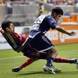 RSL's Tony Beltran battles with Cesar Elizondo for the ball as Real Salt Lake and the Carolina RailHawks play in the U.S. Open Cup on Wednesday, June 26, 2013 at Rio Tinto Stadium in Sandy. RSL beat Carolina 3-0.