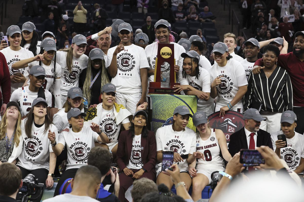 South Carolina team victorious, posing for photo during trophy presentation after defeating UConn at Target Center. Minneapolis, MN.