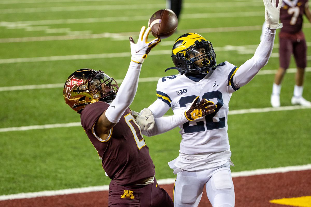 Michigan Wolverines wide receiver Giles Jackson attempts to catch a pass as Michigan Wolverines defensive back Gemon Green plays defense in the second half at TCF Bank Stadium.
