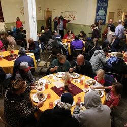 The Rescue Mission of Salt Lake serves its annual day before Thanksgiving banquet on Wednesday, Nov. 23, 2016.