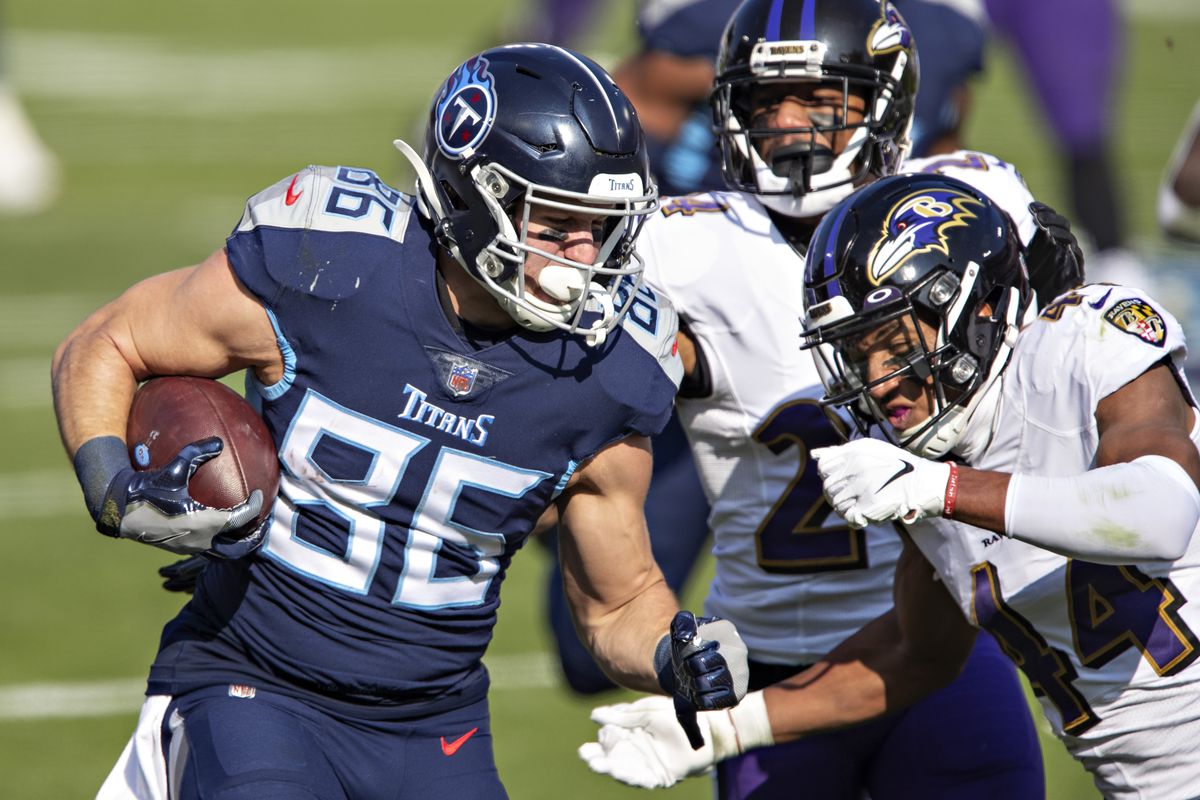 Tight end Anthony Firkser #86 of the Tennessee Titans runs the ball and is tackled during their AFC Wild Card Playoff game by cornerback Marlon Humphrey #44 of the Baltimore Ravens at Nissan Stadium on January 10, 2021 in Nashville, Tennessee.