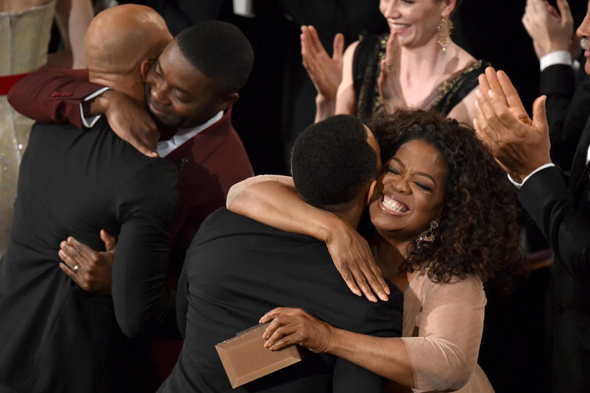 David Oyelowo, second from left, and Oprah Winfrey, right, congratulate Common, left, and John Legend, second from right, after they won the award for best original song in a feature film for “Glory” from “Selma” at the Oscars on Sunday, Feb. 22, 2015, at
