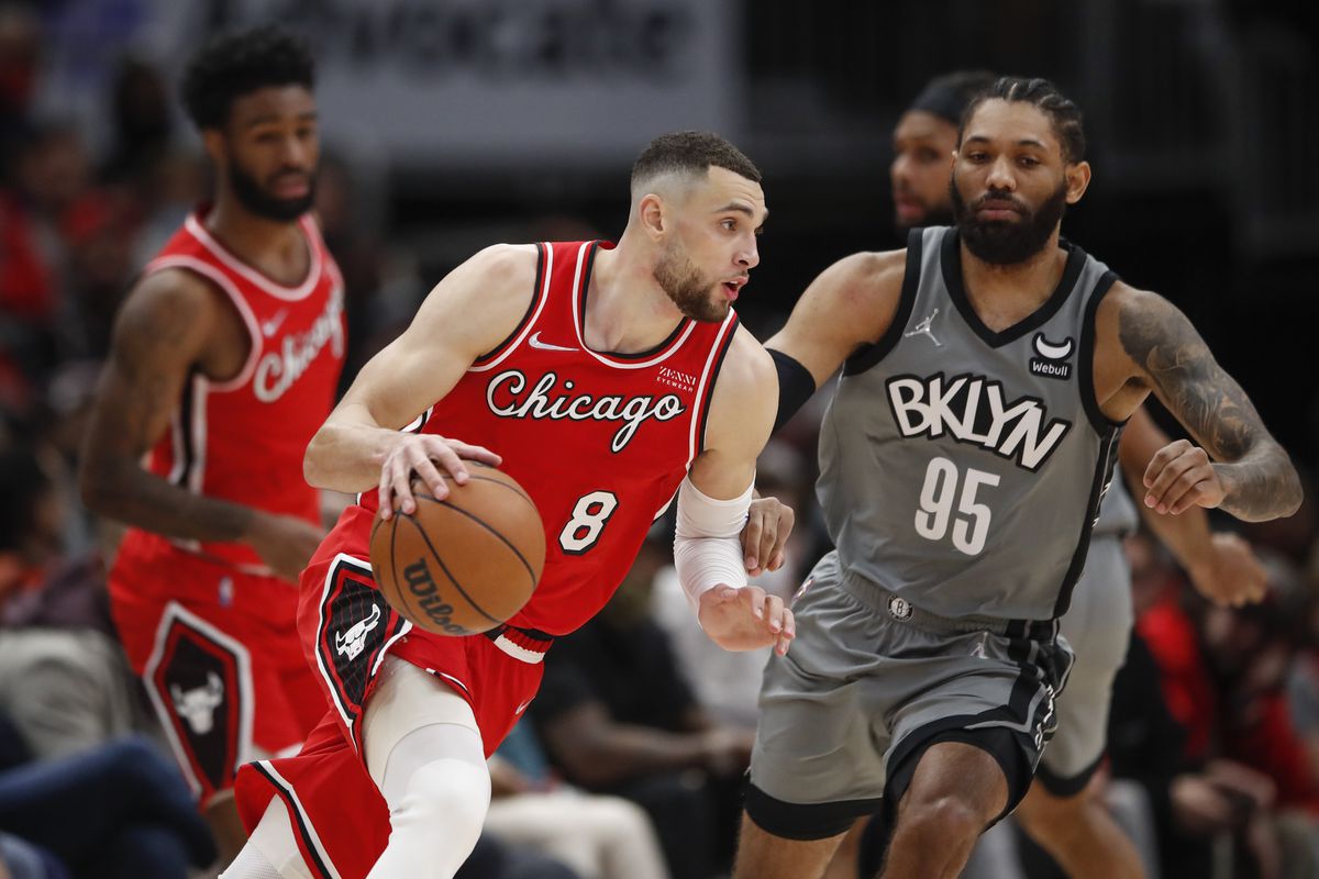 Chicago Bulls guard Zach LaVine (8) dribbles the ball while defended by Brooklyn Nets guard DeAndre’ Bembry (95) during the second half at United Center.