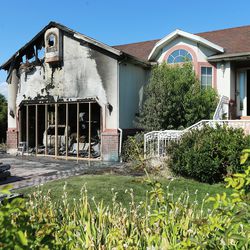 Damage from a house fire in West Valley City is pictured on Tuesday, Aug. 1, 2017. Newspaper deliveryman Matthew Hoagland helped rescue a woman from the burning home. Despite praise from firefighters who responded to the blaze, Hoagland said he doesn't consider himself a hero.