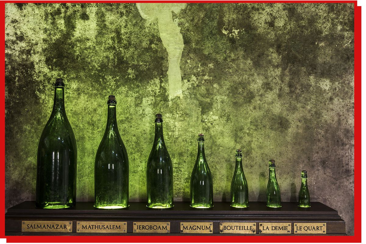 Wine bottles in a range of sizes labeled from the Slamanazar down to Le Quart.