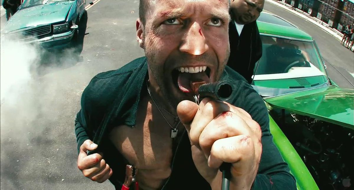 Jason Statham as Chev Chelios clamping his tongue and right nipple with jumper cables in Crank.