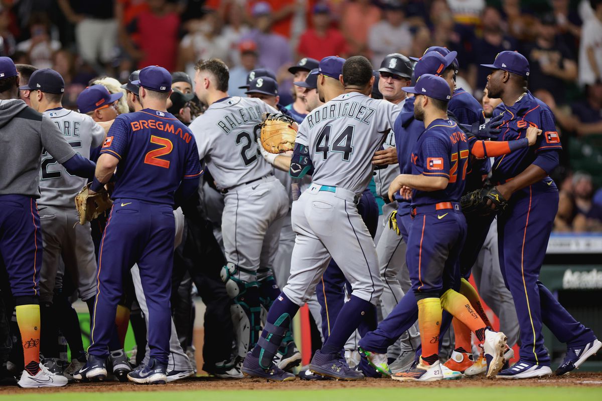 Houston Astros and Seattle Mariners benches clear after Ty France #23 of the Seattle Mariners was hit by a pitch during the ninth inning at Minute Maid Park on June 06, 2022