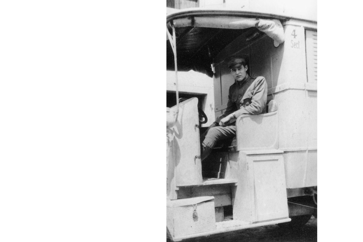 Ernest Hemingway behind the wheel of an ARC ambulance