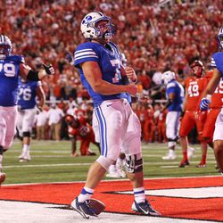 Brigham Young Cougars quarterback Taysom Hill (7) celebrates after running the ball in for a touchdown, making the score 20-19 Utah, during a game at Rice-Eccles Stadium in Salt Lake City on Saturday, Sept. 10, 2016.
