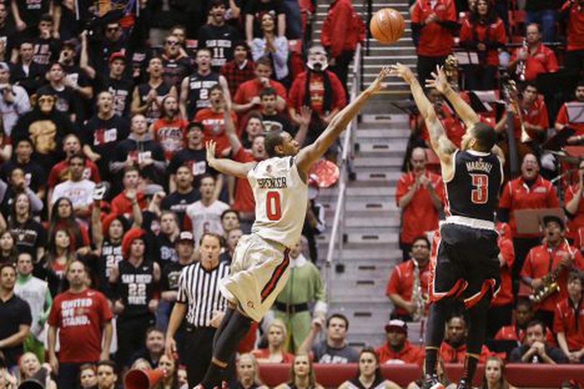 UNLV guard Anthony Marshall lets fly a jumper over San Diego State forward Skylar Spencer during the second half of UNLV's 82-75 victory in a NCAA college basketball game Wednesday Jan. 16, 2013 in San Diego. Marshall led UNLV with 20 points.