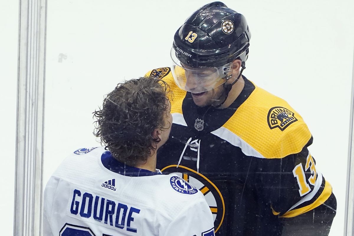 Yanni Gourde of the Tampa Bay Lightning exchanges words with Charlie Coyle of the Boston Bruins during the third period in an Eastern Conference Round Robin game during the 2020 NHL Stanley Cup Playoff at Scotiabank Arena on August 5, 2020 in Toronto, Ontario, Canada.