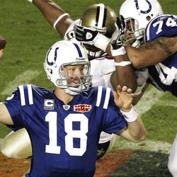 Colts QB Peyton Manning hangs his head after throwing a game-costing interception to New Orleans' Tracy Porter.