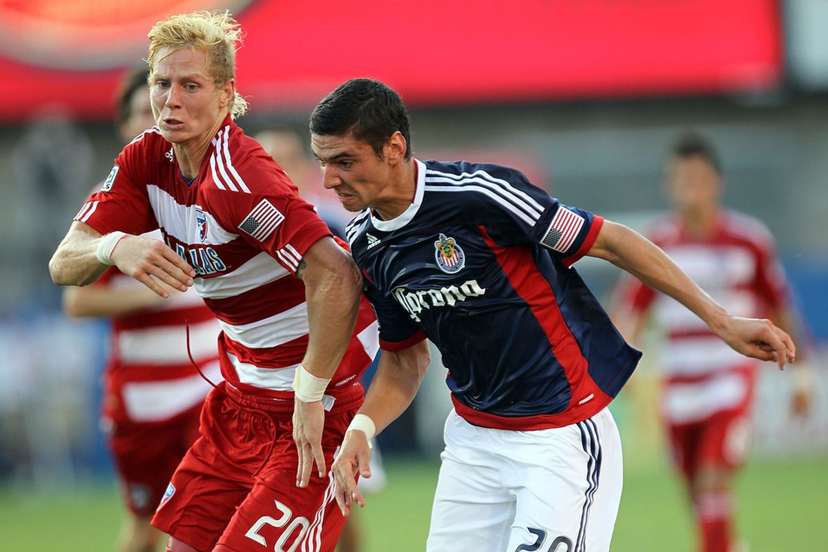 FRISCO, TX - JULY 31:  Brek Shea #20 of the FC Dallas dribbles the ball against Zarek Valentin #20 of the Chivas USA at Pizza Hut Park on July 31, 2011 in Frisco, Texas.  (Photo by Ronald Martinez/Getty Images)