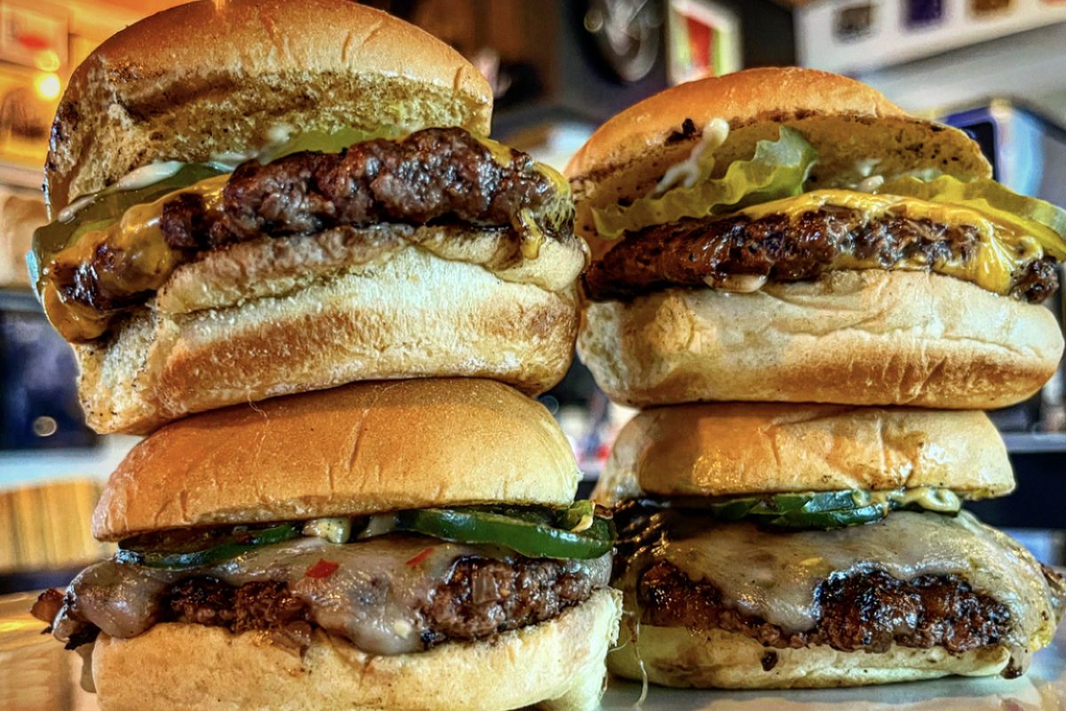 Two stacks of two slider burgers.