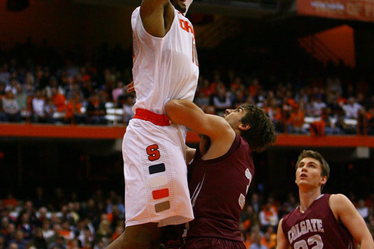 SYRACUSE, NY - NOVEMBER 19: Fab Melo #51 of the Syracuse Orange dunks the ball against John Brandenburg #3 of the Colgate Raiders during the game at the Carrier Dome on November 19, 2011 in Syracuse, New York. (Photo by Nate Shron/Getty Images)