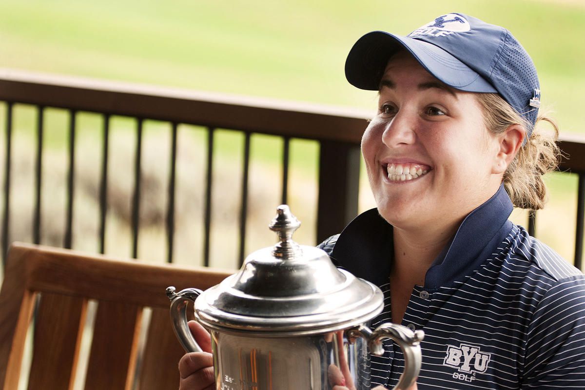 Kendra Dalton smiles with the perpetual cup after winning the 110th Utah Women's State Amateur Golf Tournament Finals at Victory Ranch in Kamas, Friday, Aug.  5, 2016.