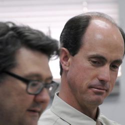 FILE - In this July 9, 2015, file photo, Seth Jeffs, right, the brother of Warren Jeffs, the imprisoned leader of a polygamist sect, participates in a state water board meeting in Pierre, S.D. South Dakota regulators approved Wednesday, Oct. 14, 2015, the secretive polygamist group's request to draw water more quickly at its Black Hills compound even though the sect declined to provide many details about how many people live there. 