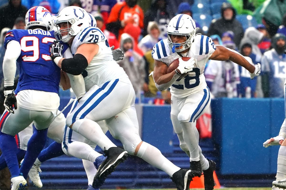Jonathan Taylor #28 of the Indianapolis Colts runs the ball during the fourth quarter in the game against the Buffalo Bills at Highmark Stadium on November 21, 2021 in Orchard Park, New York.