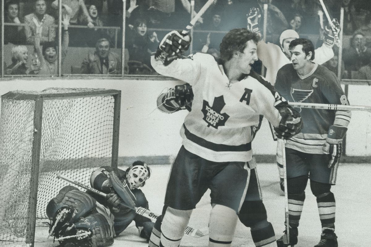Joyful Moment for Leafs is pinpointed by Darryl Sittler who raises stick as he wheels away from fall