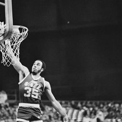 Guard Darrell Griffith of the Utah Jazz slams the ball through the hoop after taking a Seattle turnover the length of the court at the Kingdome in Seattle December 29, 1983. Griffith had 28 points as the Jazz defeated the Sonics 113-105. (AP Photo/Greg Lehman)