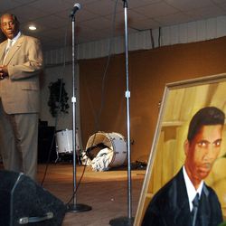Charles Evers, brother of slain civil rights leader Medgar Evers, speaks during a memorial service for the 40th anniversary of Evers' assassination, Thursday evening, June 5, 2003, in Jackson, Miss. Charles Evers said that his brother, shown in a painting placed by the stage, fought to give black Mississippians the same rights as whites--the rights to vote, to run for office, to send their children to decent schools and to shop wherever they wanted. Evers was assassinated outside his Jackson home on June 12, 1963.