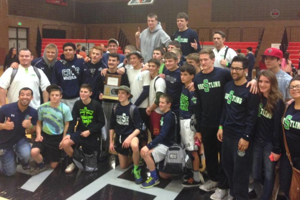Syracuse's wrestling team celebrates its 5A Divisional B title at Alta High School on Saturday.