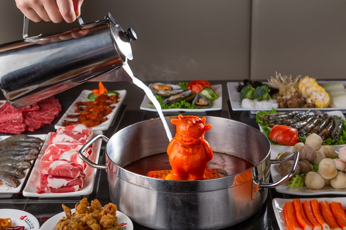 pouring broth over small cow figurine