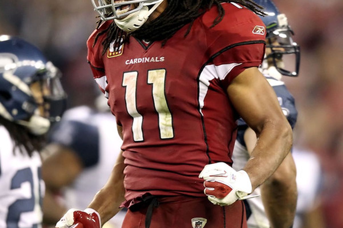 Wide receiver Larry Fitzgerald #11 of the Arizona Cardinals celebrates after a circus catch reception in overtime against the Seattle Seahawks.  (Photo by Christian Petersen/Getty Images)