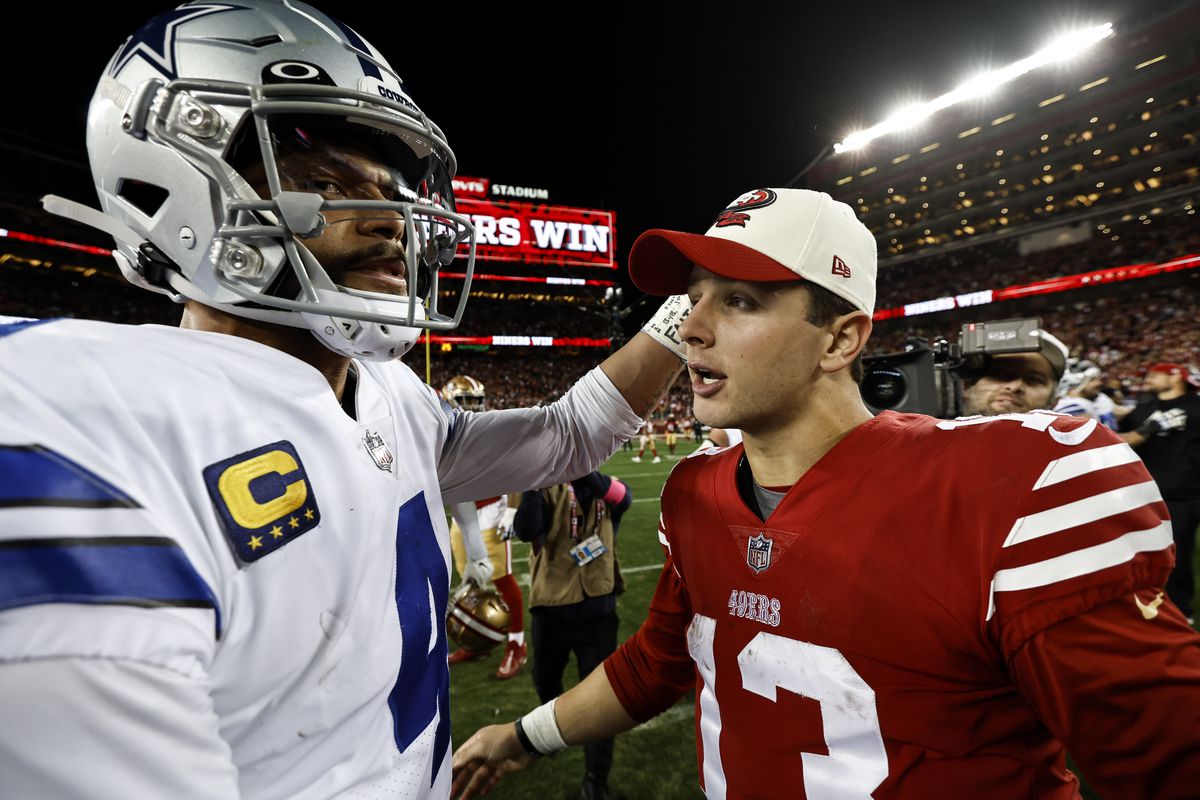 Brock Purdy #13 of the San Francisco 49ers meets with Dak Prescott #4 of the Dallas Cowboys following an NFL divisional round playoff football game between the San Francisco 49ers and the Dallas Cowboys at Levi’s Stadium on January 22, 2023 in Santa Clara, California.