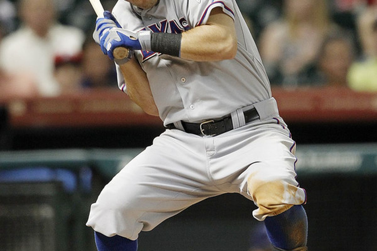HOUSTON - MAY 18:  Ian Kinsler #5 of the Texas Rangers ducks to avoid being hit in the head by a pitch  by Rhiner Cruz #55 of the Houston Astros at Minute Maid Park on May 18, 2012 in Houston, Texas.  (Photo by Bob Levey/Getty Images)