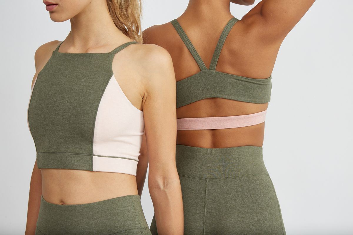 Two models wear olive and pink crop tops.