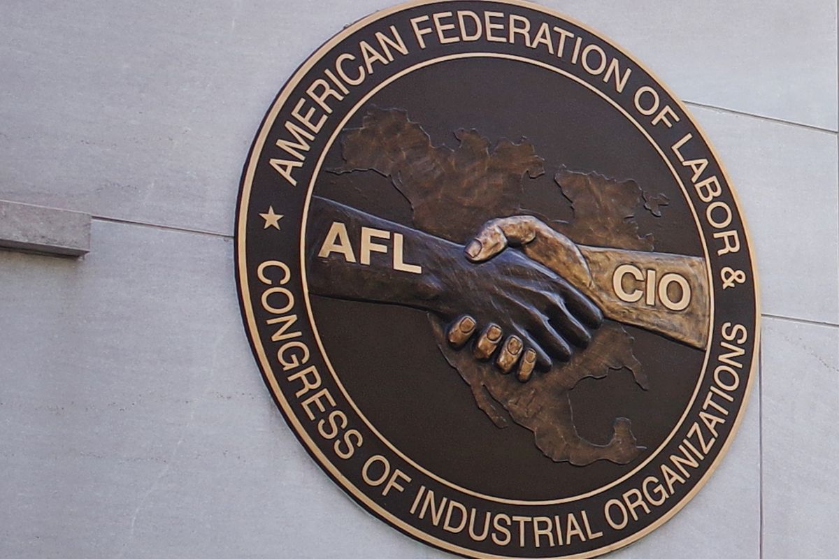 A photo of the seal of the The American Federation of Labor and Congress of Industrial Organizations (AFL-CIO) is seen in front of its headquarters