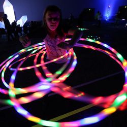 Rylee Lawrence hoola hoops at EVE WinterFest at the Salt Palace in Salt Lake City on Thursday, Dec. 31, 2015.