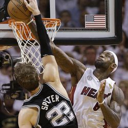Miami Heat small forward LeBron James (6) blocks a shot by San Antonio Spurs center Tiago Splitter (22) of Brazil, during the second half of Game 2 of the NBA Finals basketball game, Sunday, June 9, 2013 in Miami. The Miami Heat won 103-84. (AP Photo/Lynne Sladky)