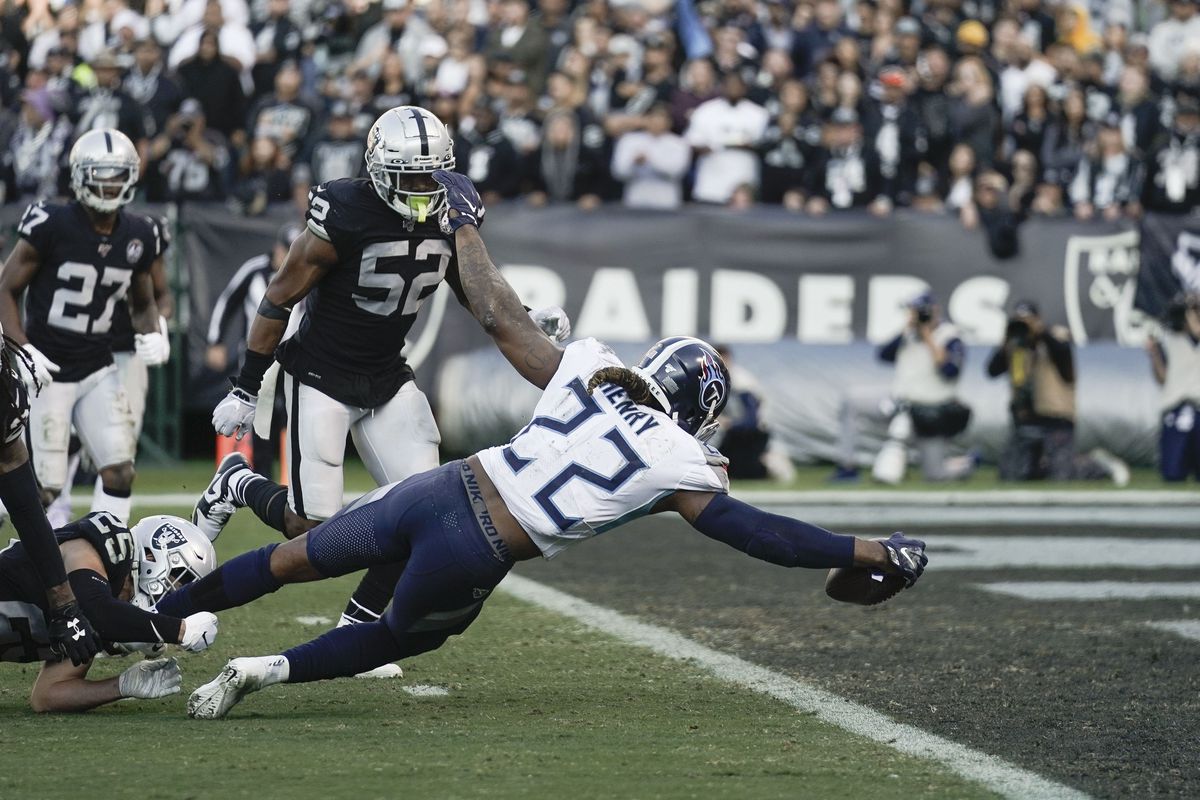 Tennessee Titans running back Derrick Henry stretches out for a touchdown against the Oakland Raiders during the third quarter at Oakland Coliseum.