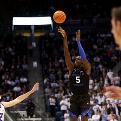 Brigham Young Cougars forward Gideon George (5) puts in a 3-point shot as BYU and Westminster play at the Marriott Center in Provo on Wednesday, Dec. 29, 2021. BYU won 65-53.