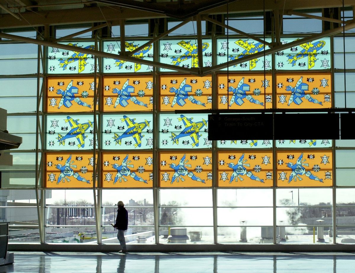 Artist Karl Wirsum created this glass mural, “Tuskegee Airmen Commemorative, 2000,” which was installed at the south end of Midway Airport’s ticketing hall.