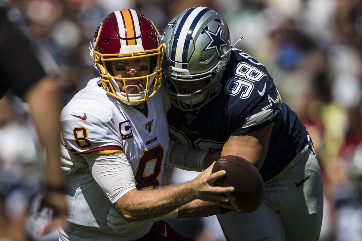 Tyrone Crawford of the Dallas Cowboys sacks Case Keenum of Washington during the first half at FedExField on September 15, 2019 in Landover, Maryland.