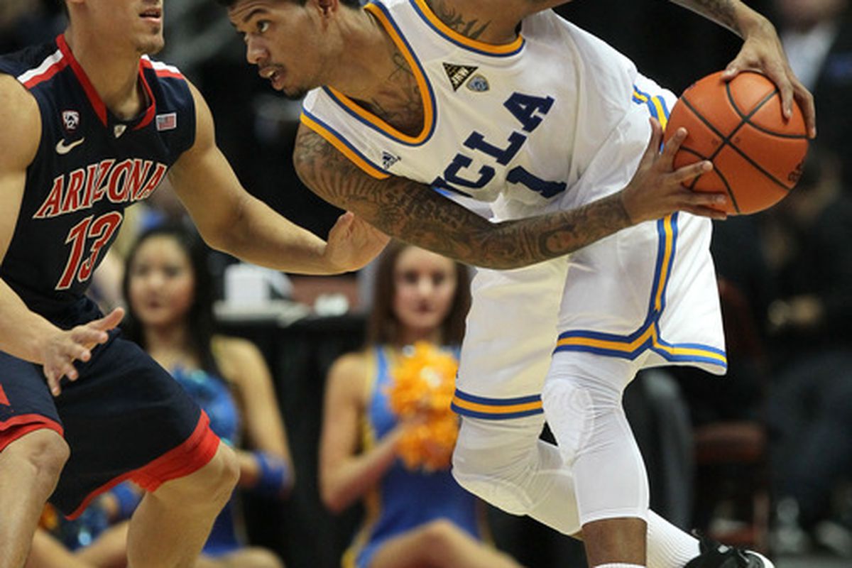 ANAHEIM, CA - JANUARY 05:  Tyler Lamb #1 of the UCLA Bruins controls the ball against Nick Johnson #13 of the Arizona Wildcats at the Honda Center on January 5, 2012 in Anaheim, California.  UCLA won 65-58.  (Photo by Stephen Dunn/Getty Images)