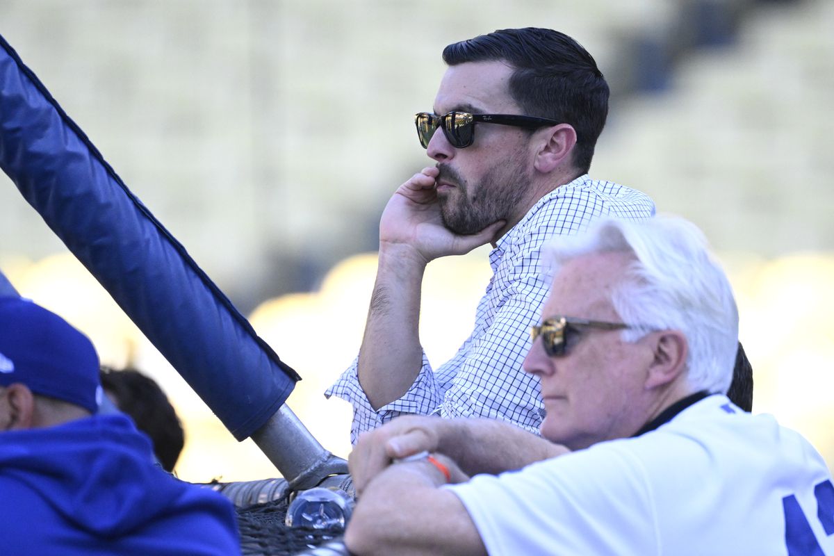 Brandon Gomes, left, General manager of the Los Angeles Dodgers watches batting practice with Mark Walter, part-owner and chairman of the Los Angeles Dodgers prior to Game 1 of a National League Division Series baseball game between the Los Angeles Dodgers and the Arizona Diamondbacks at Dodger Stadium in Los Angeles on Saturday, October 7, 2023.