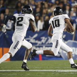 Utah State Aggies linebacker Tipa Galeai (22)) streaks free for a pick-six during the Utah State versus BYU football game at LaVell Edwards Stadium in Provo on Friday, Oct. 5, 2018.