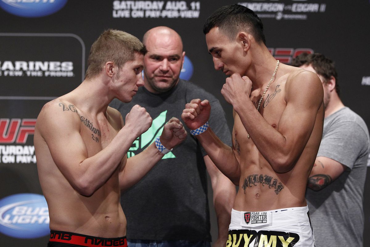Justin Lawrence (left) and Max Holloway square off during the UFC 150 weigh-ins at the Pepsi Center in Denver on Friday, Aug. 10, 2012. Photo by Esther Lin/MMA Fighting.