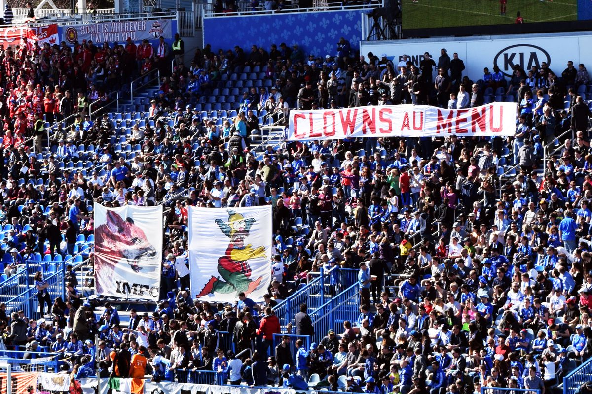 April 23, 2016. Supporters group 1642 Montreal flies a tifo featuring the Impact fox and Krusty the Clown, reading “Clowns au menu.”