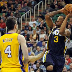 Utah Jazz point guard Trey Burke (3) passes the ball during a game at EnergySolutions Arena on Friday, Dec. 27, 2013.