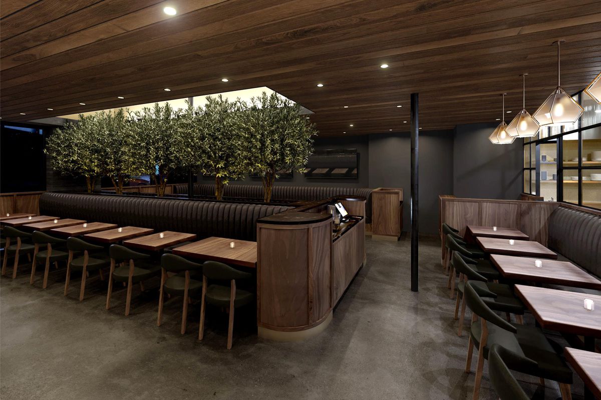 A rendering for a brooding steakhouse with dark booths and lots of wood.