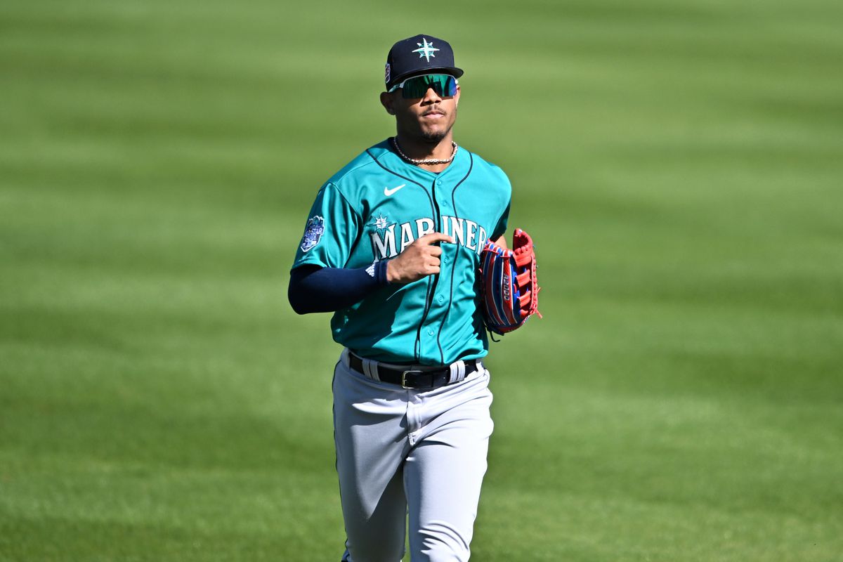 Julio Rodríguez #44 of the Seattle Mariners runs off the field after the fourth inning of a spring training game against the San Diego Padres at Peoria Stadium on February 24, 2023 in Peoria, Arizona.