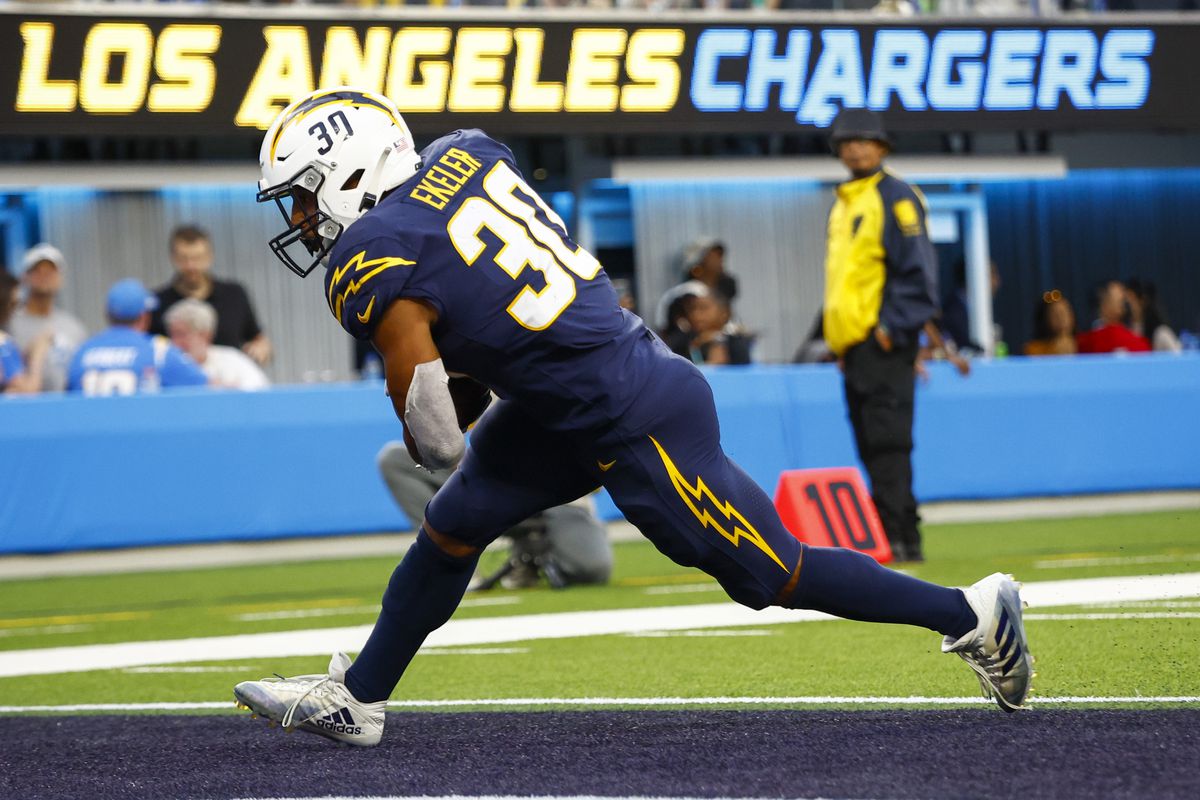 Austin Ekeler #30 of the Los Angeles Chargers scores a touchdown during the first half of the game against the Seattle Seahawks at SoFi Stadium on October 23, 2022 in Inglewood, California.