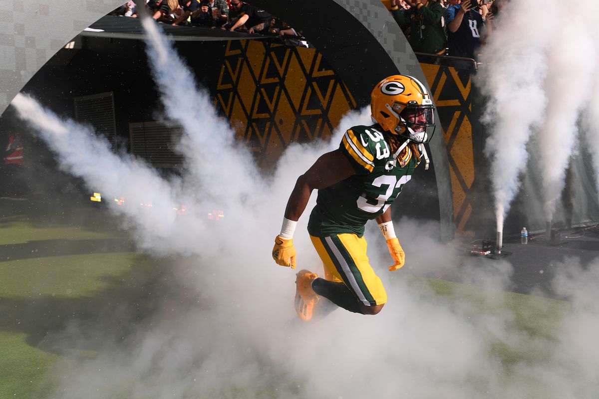 Aaron Jones #33 of the Green Bay Packers enters the field prior to the NFL match between New York Giants and Green Bay Packers at Tottenham Hotspur Stadium on October 09, 2022 in London, England.