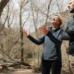 Sen. Elizabeth Warren, D-Mass., looks over the view with Carl Fisher, of Save Our Canyons, at Storm Mountain picnic area in Big Cottonwood Canyon on Wednesday, April 17, 2019.